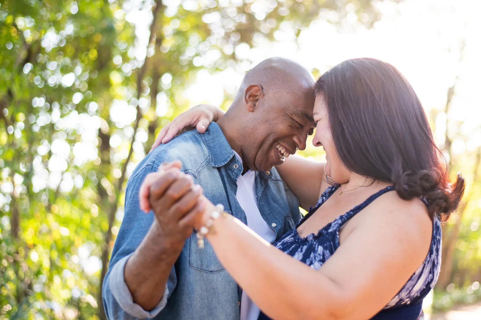 A couple embracing, foreheads together