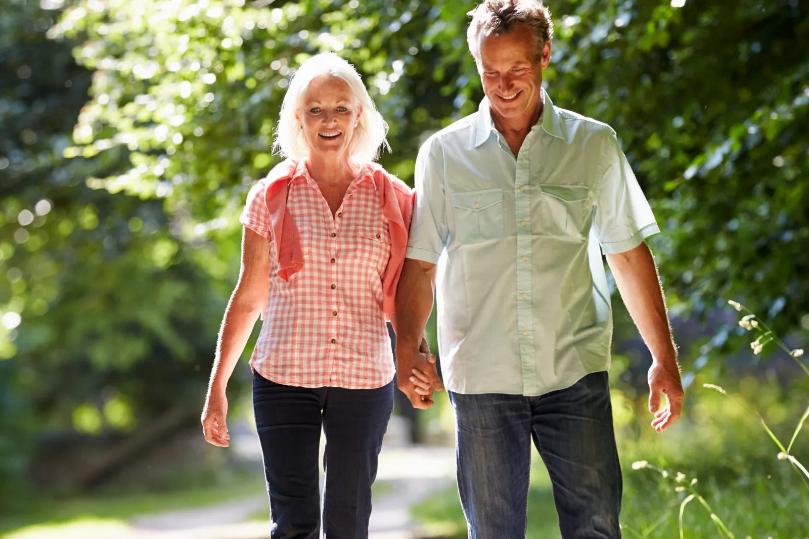 A couple walking together, holding hands